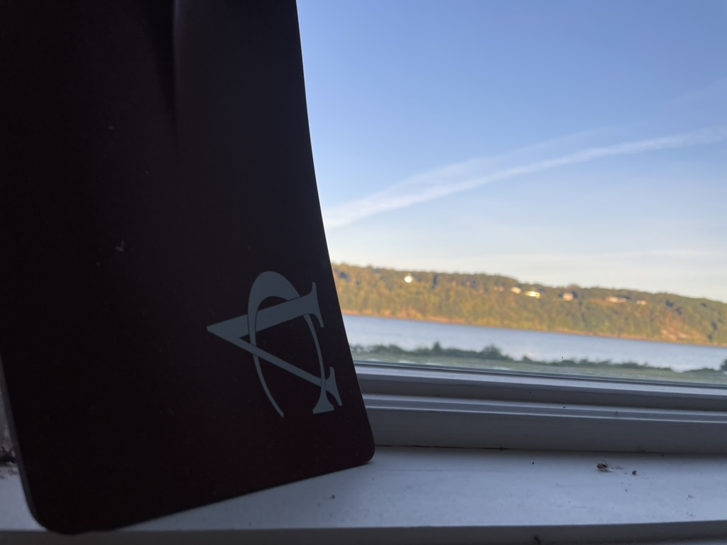 A blade in the boathouse window with the Hudson behind