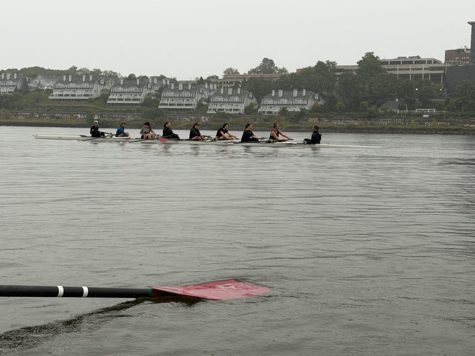 An eight passing the Poughkeepsie shoreline