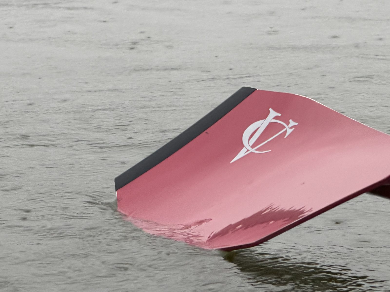 A Vassar blade, burgundy with the VC mark, resting on the Hudson